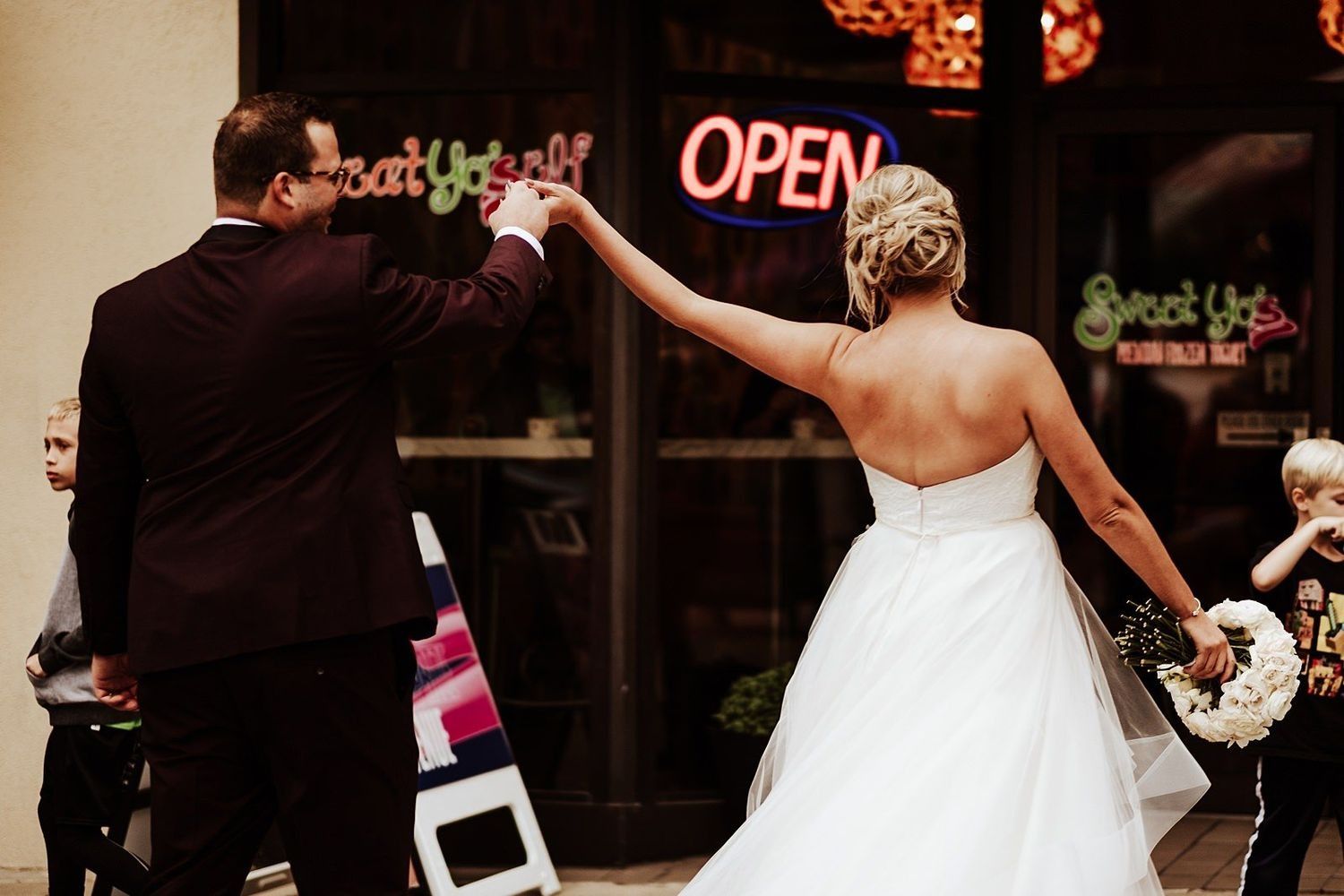 Modern neon sign decor at the entrance of The Ballroom at McKay for a luxury Michigan wedding.
