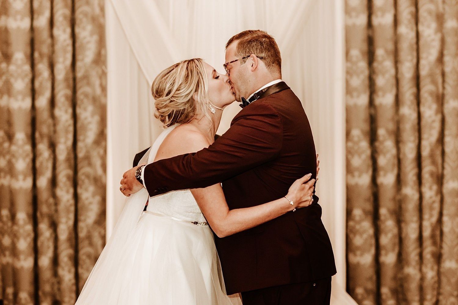 The first kiss as husband and wife: Shannon and Karel at McKay Ballroom