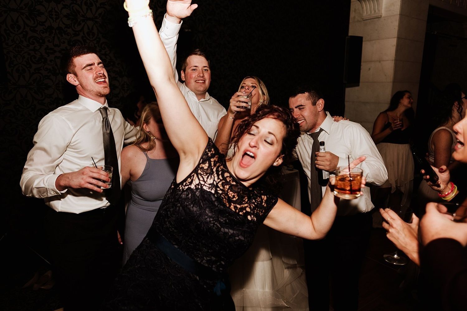 High-energy party photography: spontaneous laughter and dancing at the wedding reception