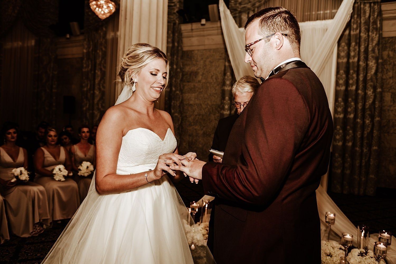 Close-up of the wedding ring exchange during the ceremony in Grand Rapids