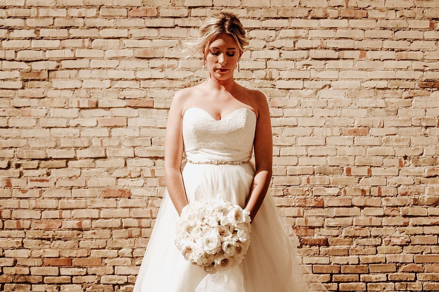 Intimate moments of Shannon contemplating her wedding bouquet