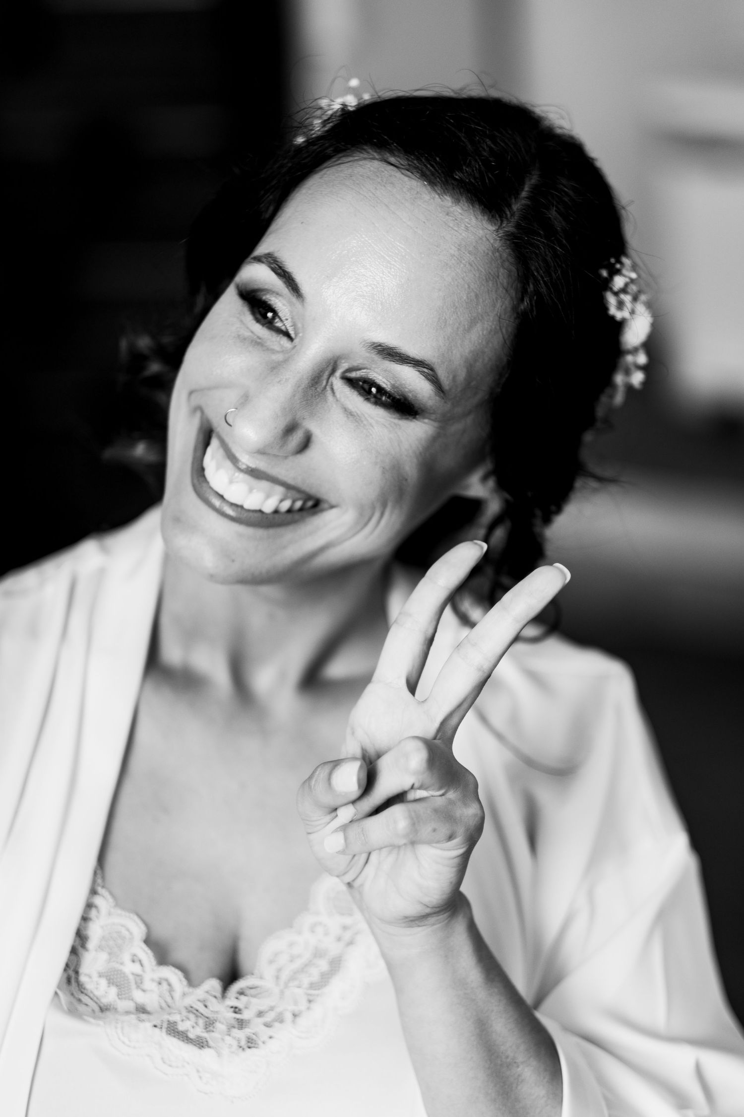 Series of black and white portraits showing joyful expressions and natural smiles.