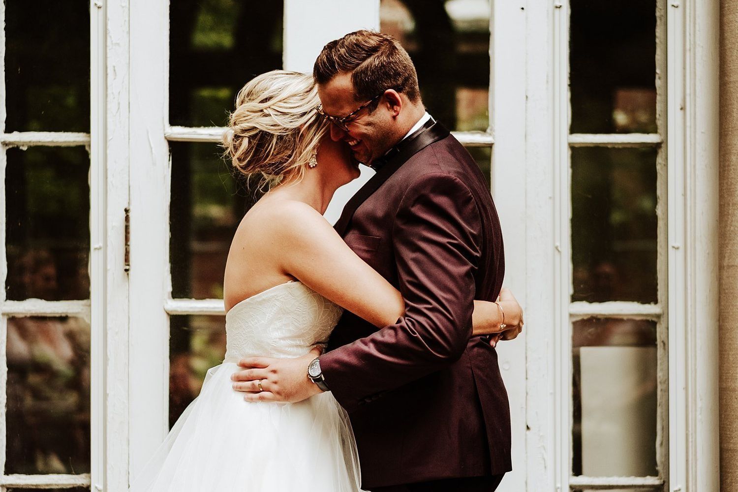 Intimate close-up portrait of Shannon and Karel embracing during their urban session