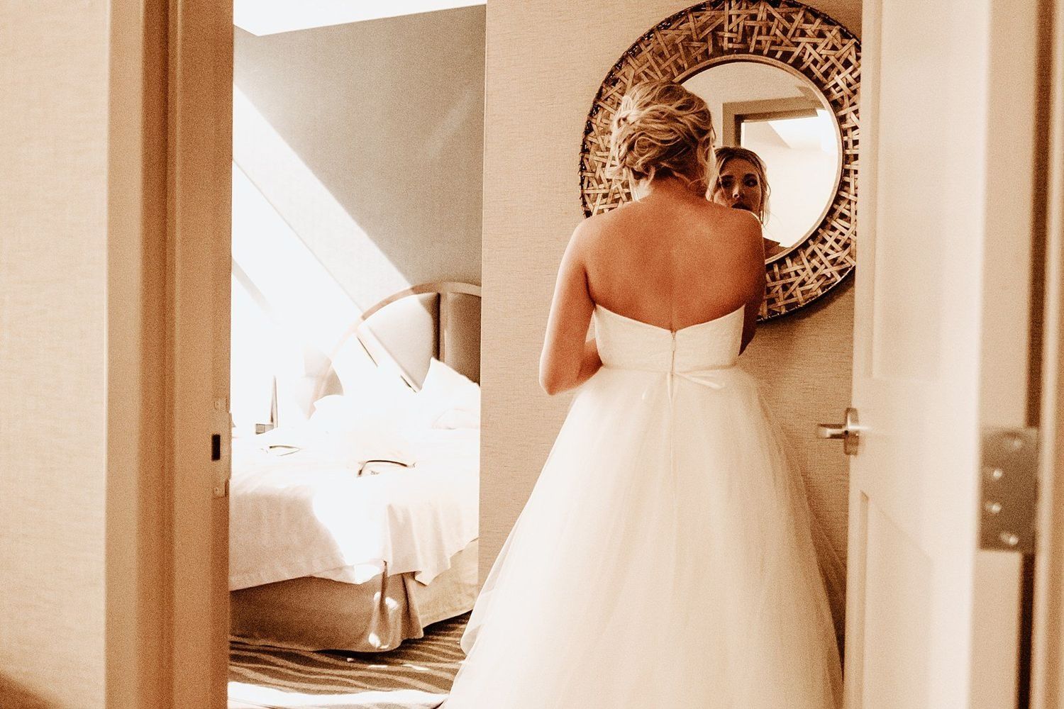 Artistic reflection of the bride in a Grand Rapids hotel mirror