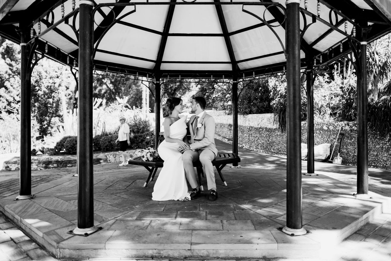 Black and white panoramic view of a wedding gazebo with architectural details and columns.