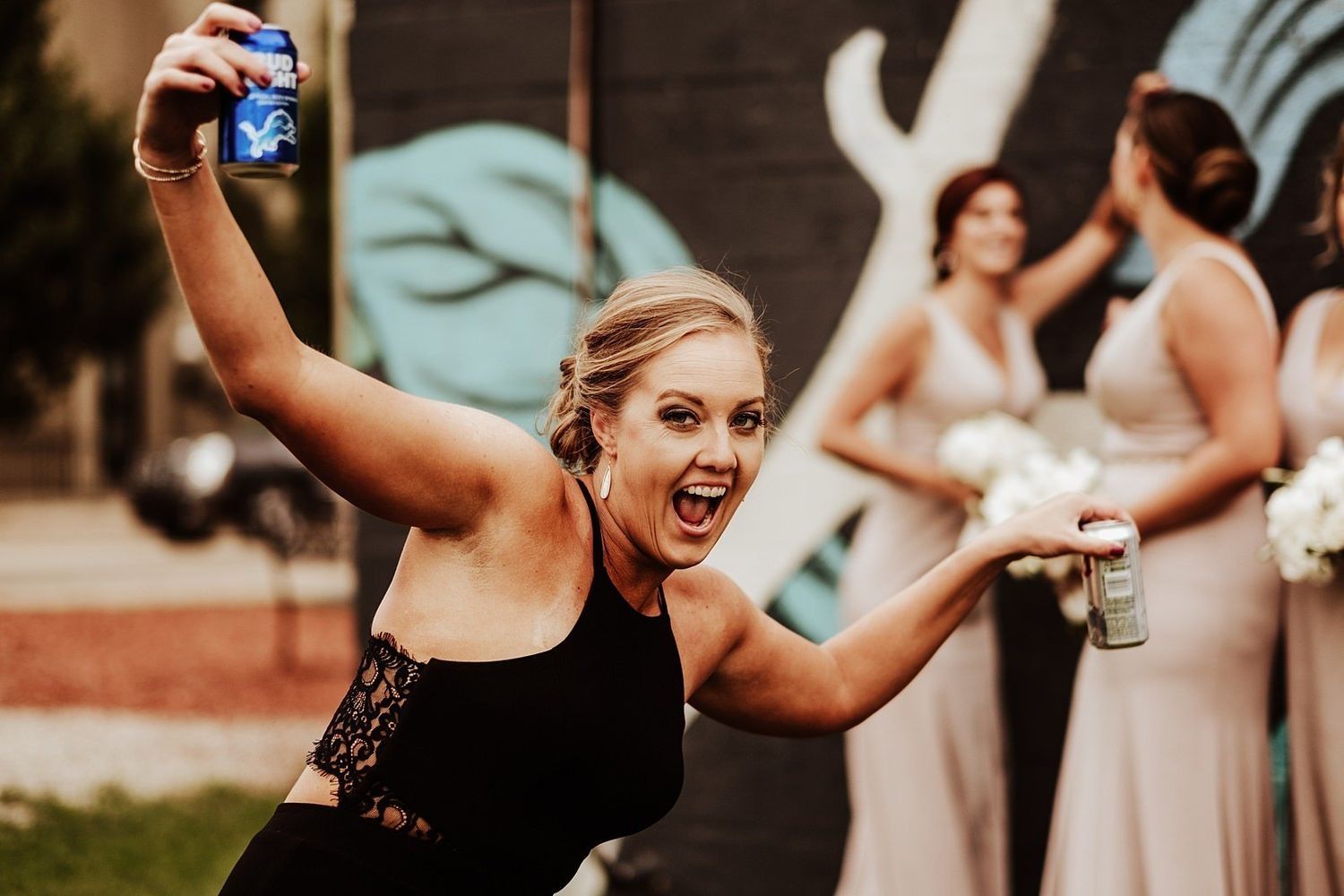 Fun and candid wedding guests enjoying the lively party with the newlyweds in Michigan