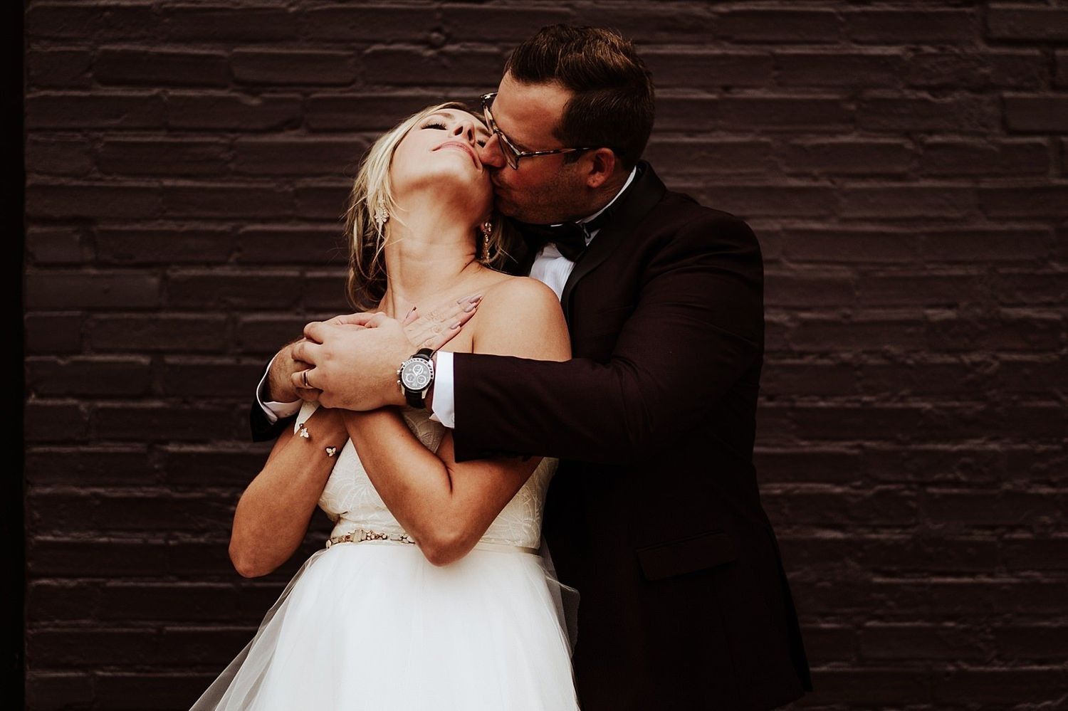 Intimate urban embrace: Shannon and Karel during their wedding portrait session.