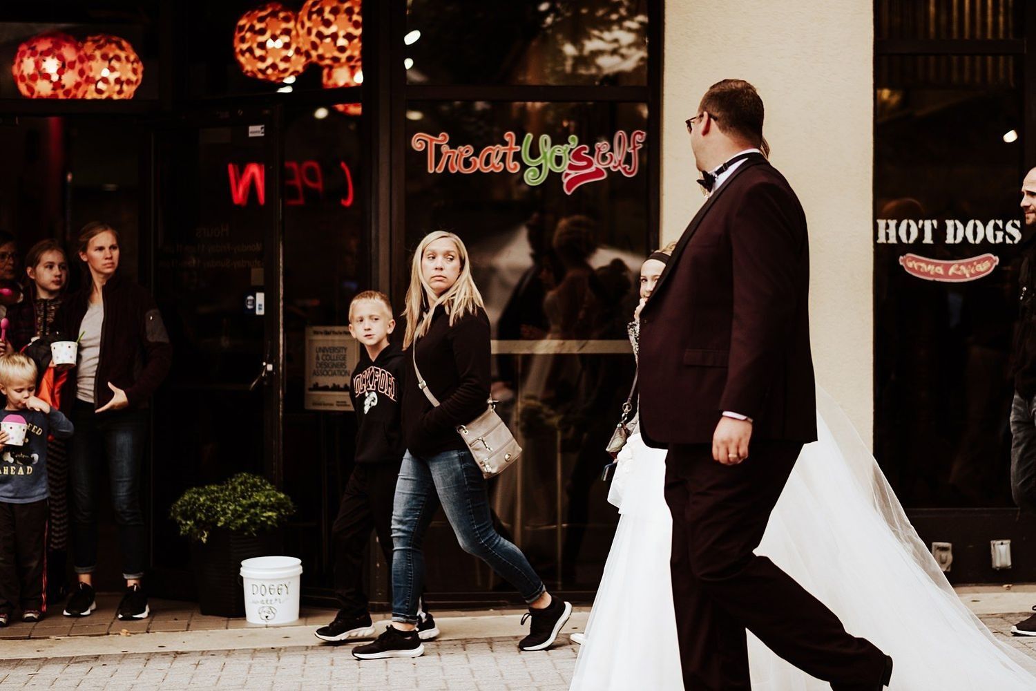 documentary photography of Shannon and Karel walking naturally through Grand Rapids streets