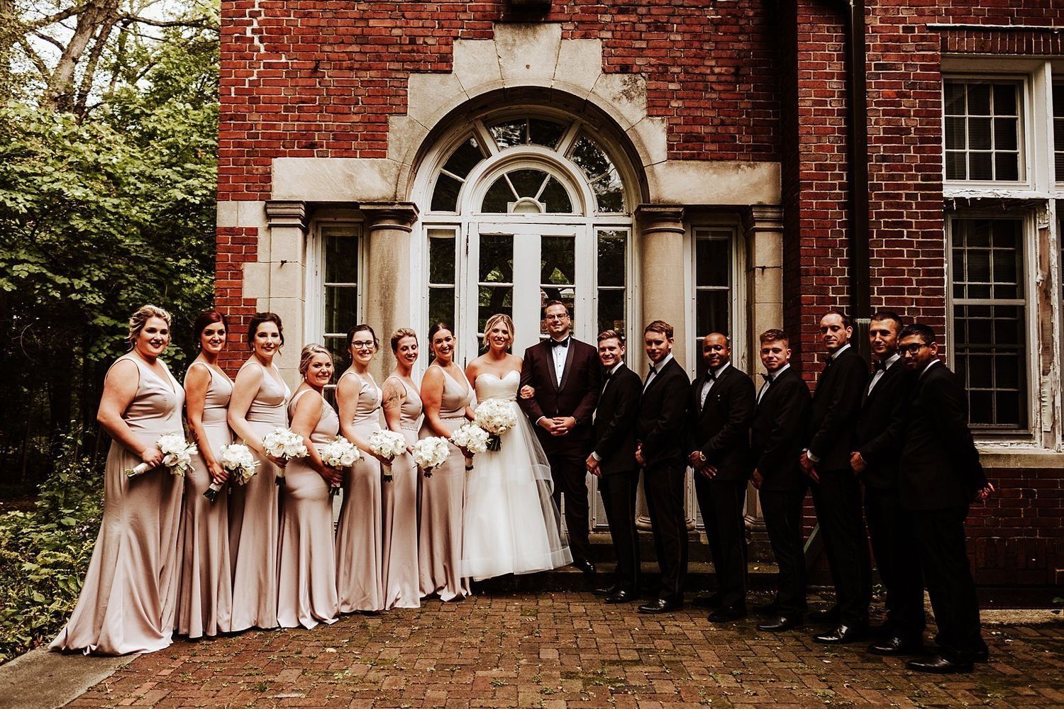 Symmetrical bridal party portrait with Shannon and Karel in the center and their attendants