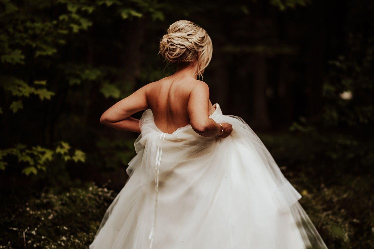 Natural bridal portrait of Shannon in her wedding dress at a luxury Grand Rapids hotel