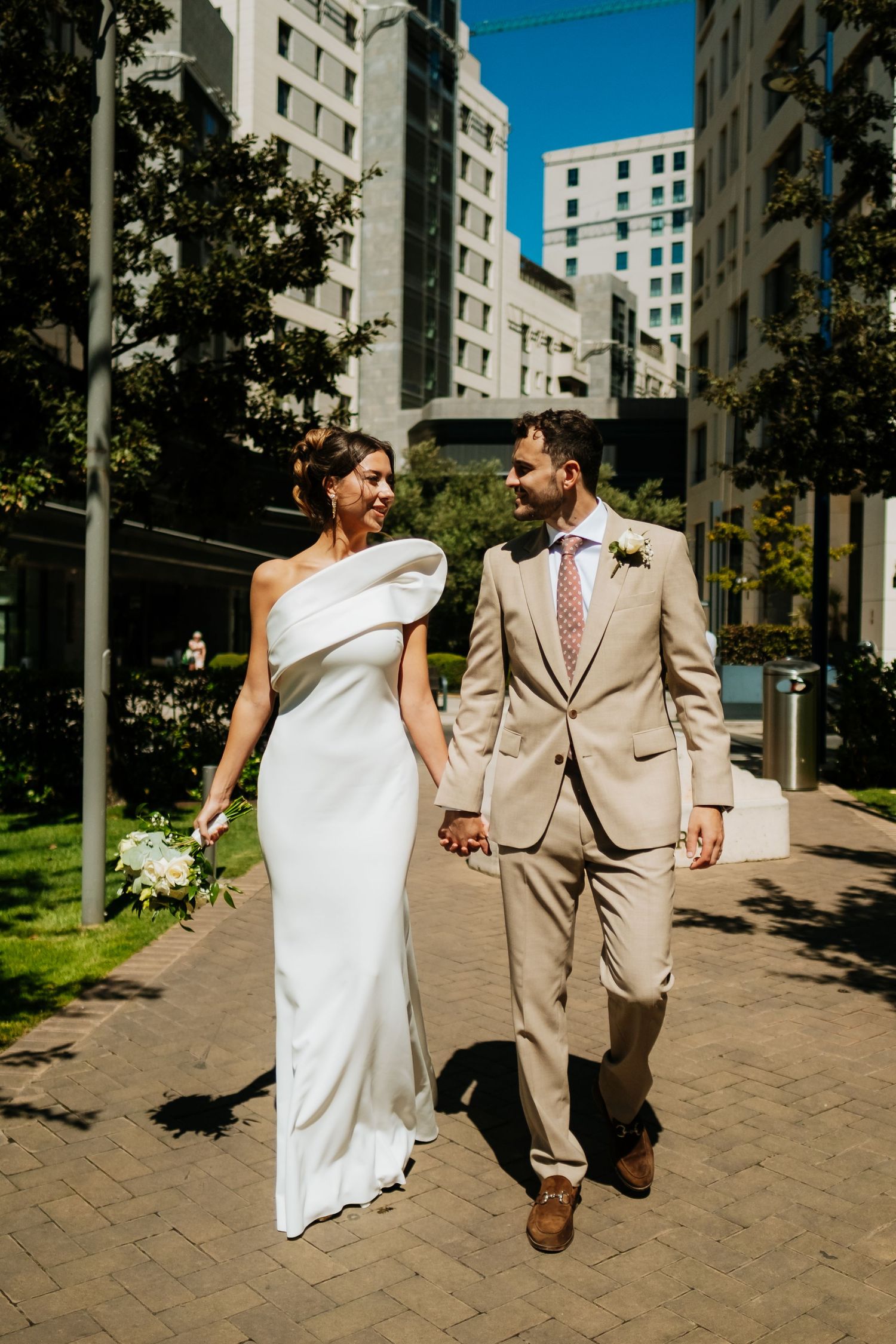 Just married couple walking in Gibraltar - Natural wedding photography