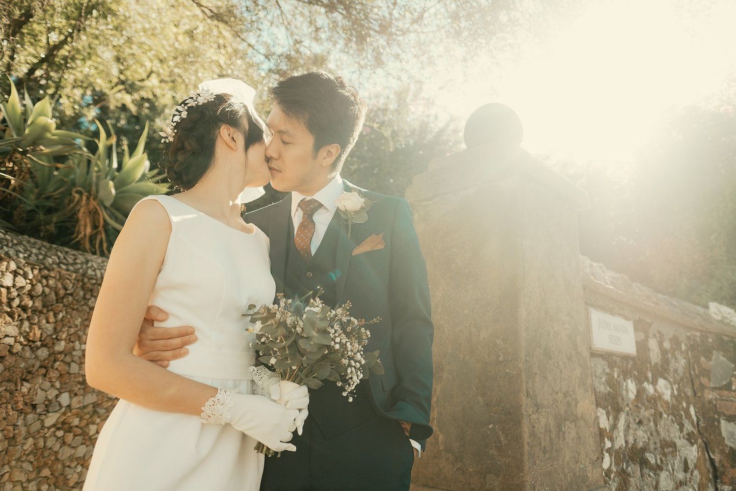 Romantic kiss on the stairs Alameda Botanic Gardens Gibraltar wedding photography