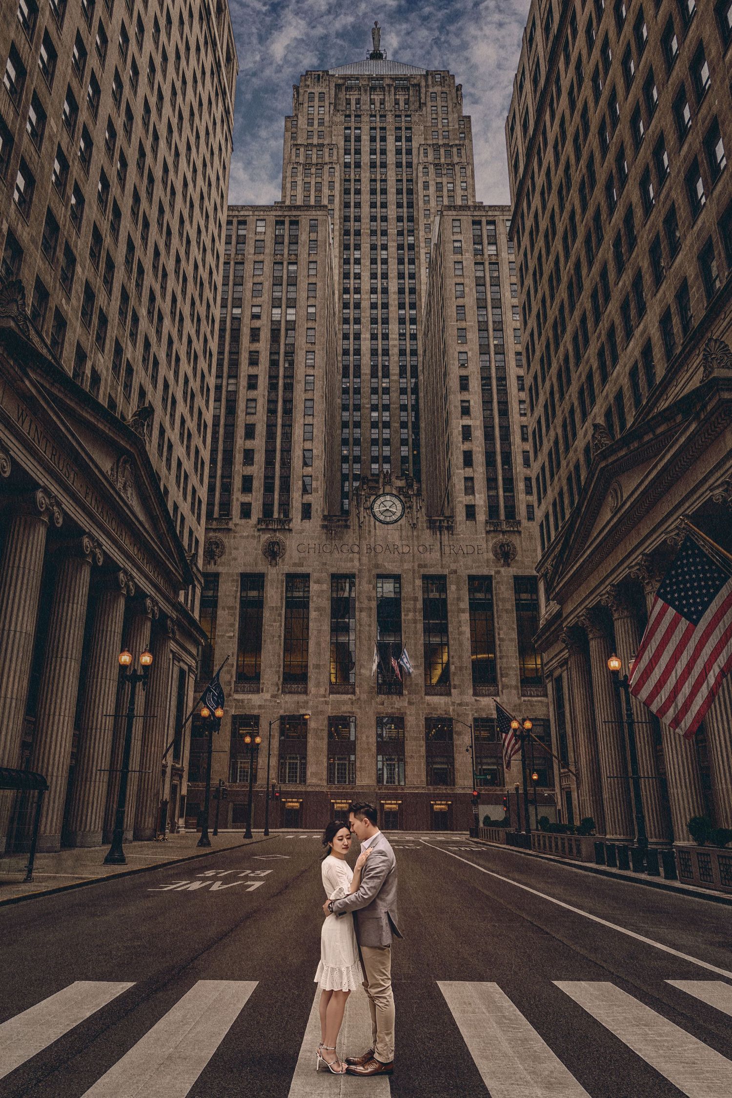 Dark modern skyscraper buildings in downtown Chicago frame an intimate moment in the city street.