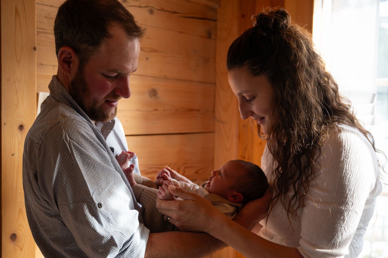 Series of tender moments captured in a rustic wooden interior setting.
