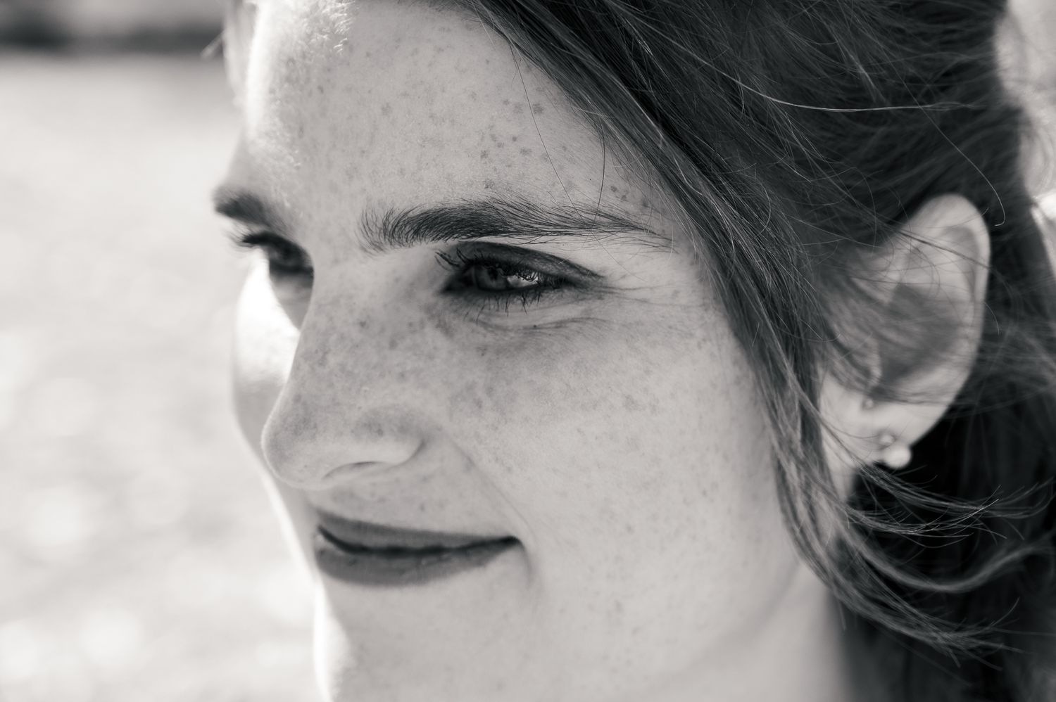 A series of black and white headshots showing different facial expressions and emotions.
