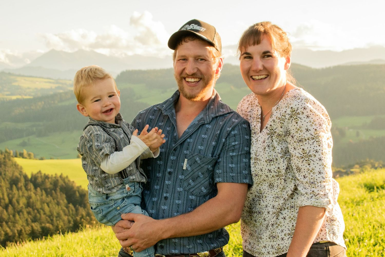 Family spending quality time together in a scenic mountain landscape at sunset.