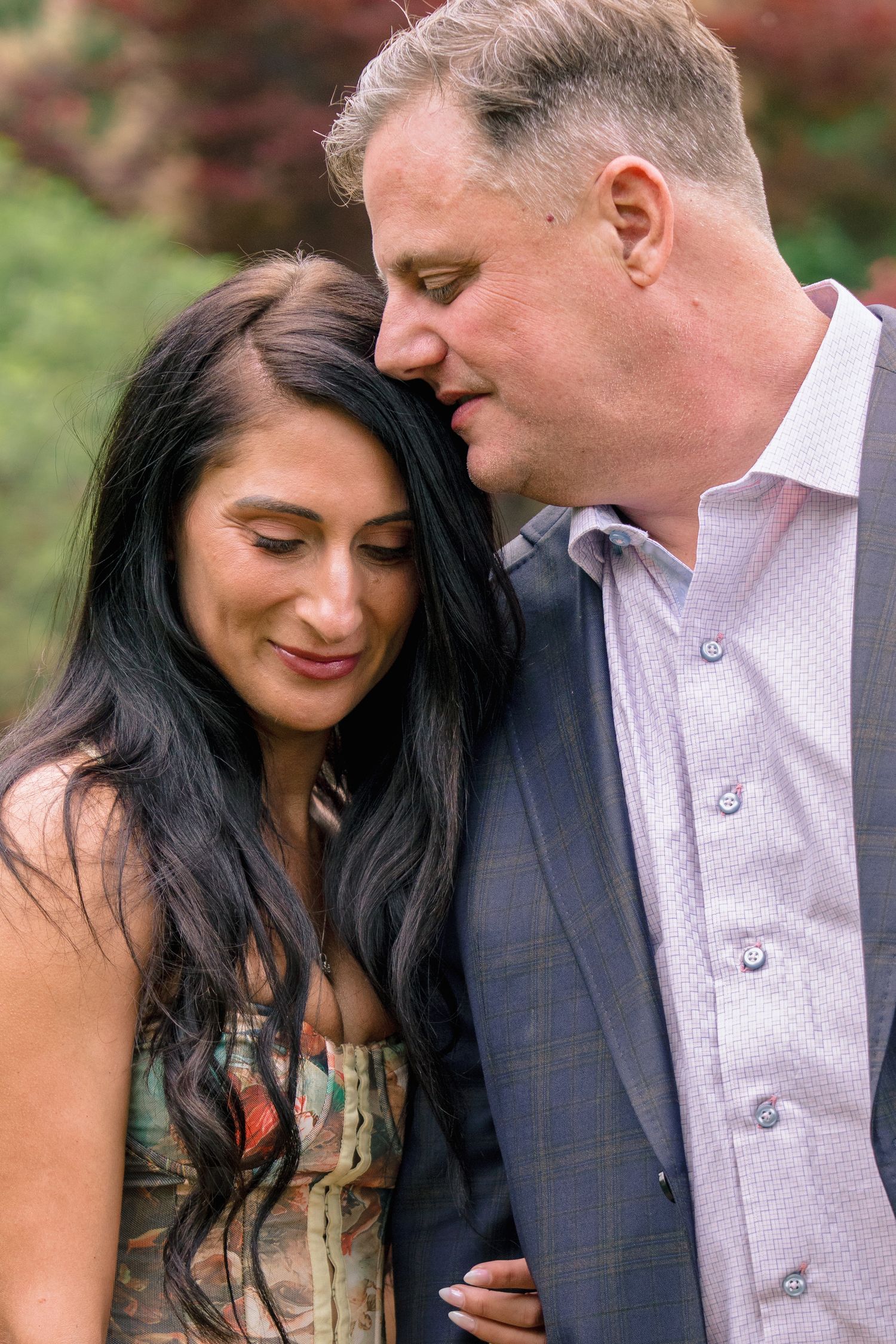 A romantic couple in formal attire share intimate moments in a series of connected outdoor portrait photographs.