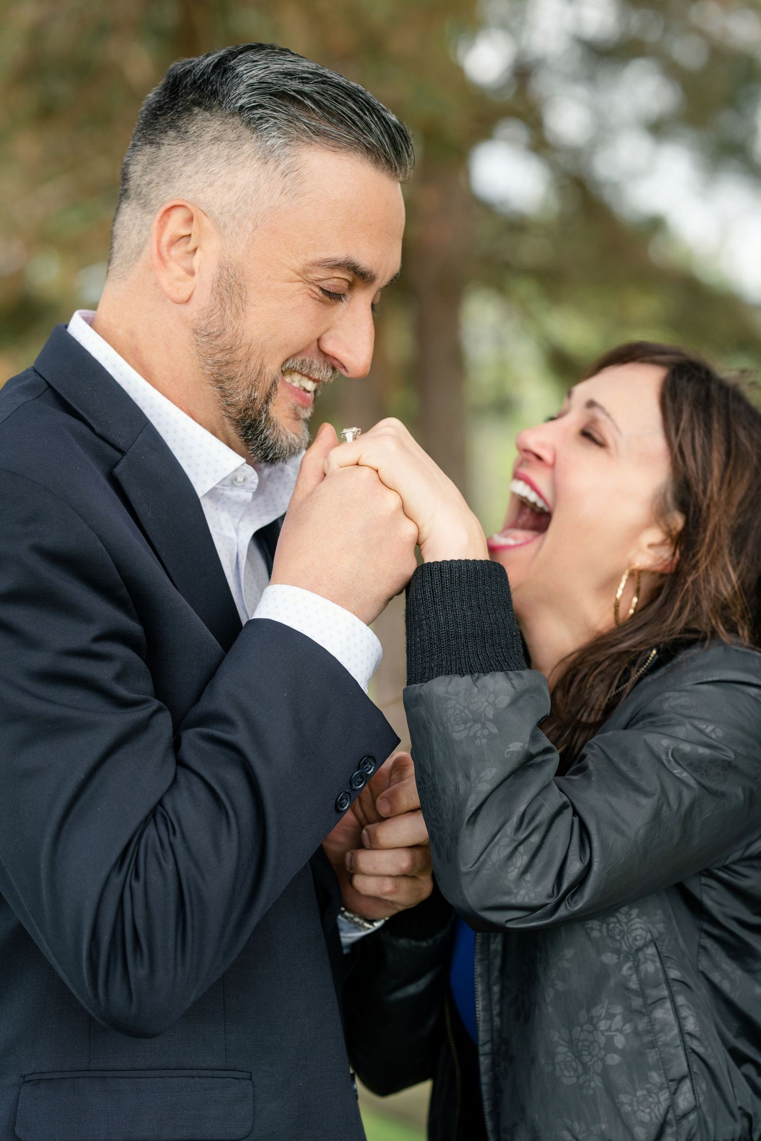 Close-up sequence of a joyful couple sharing an intimate moment in a natural setting.
