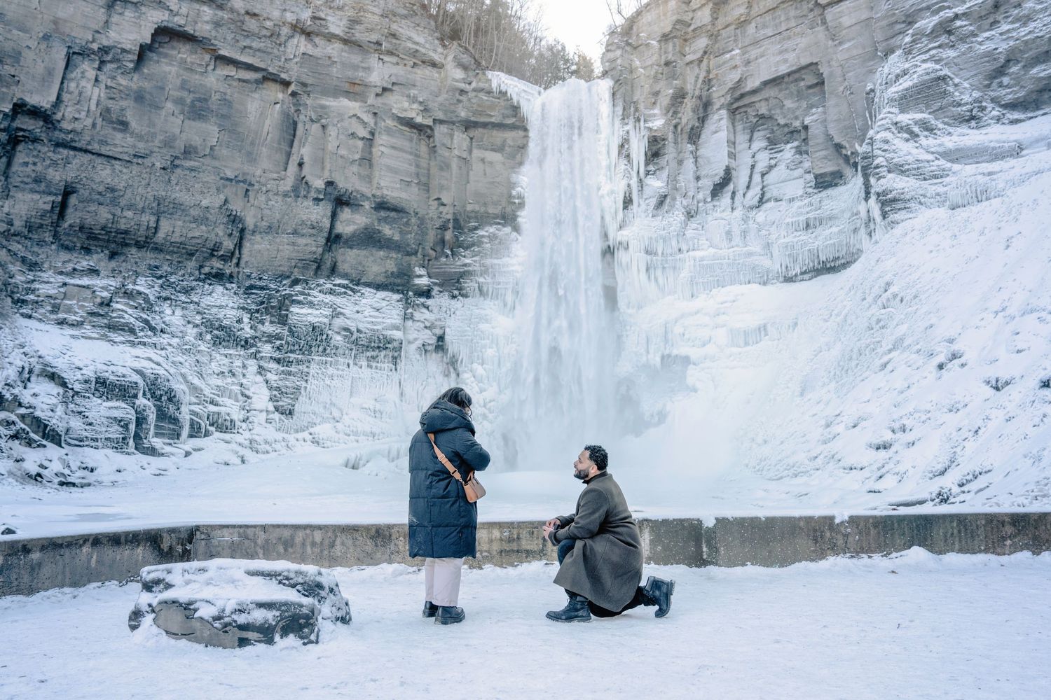 A series of winter scenes showing people exploring a frozen waterfall with ice climbing gear and snowy cliffs.