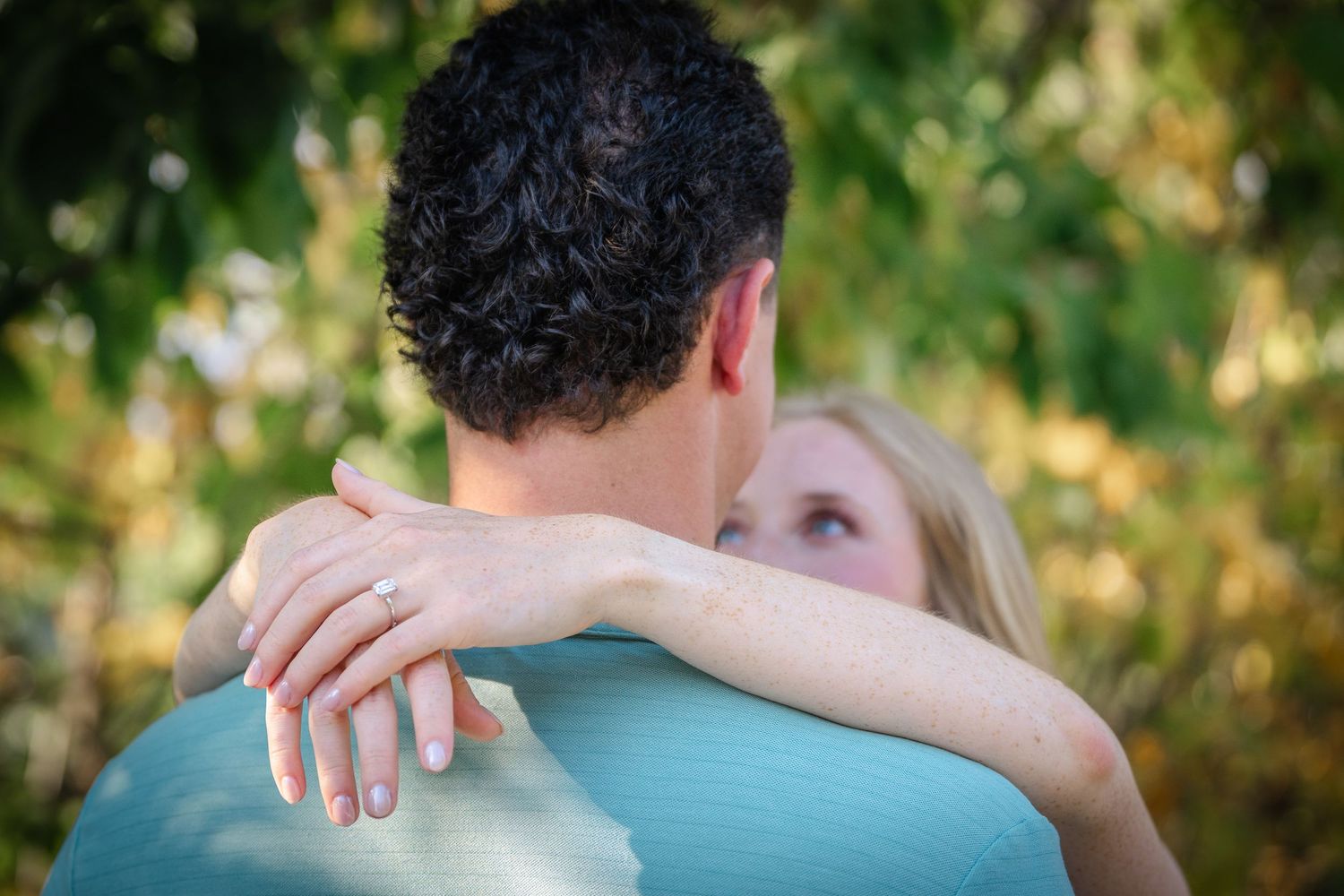Close-up shots of a couple embracing outdoors on a sunny day.