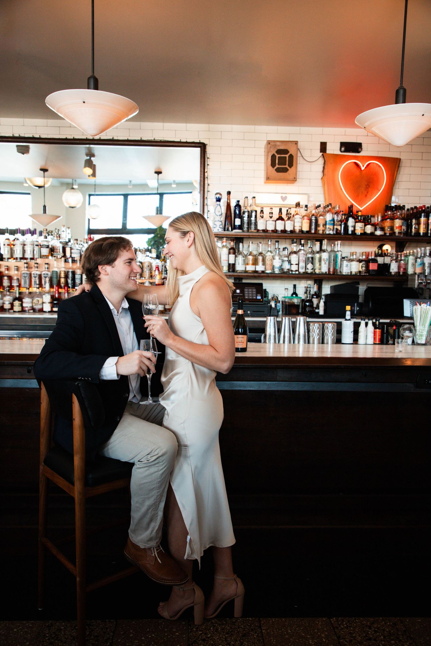 Romantic bar engagement session at Olive and Oak, St. Louis. Authentic couples photography by Faith’s Flicks. Book your engagement session!