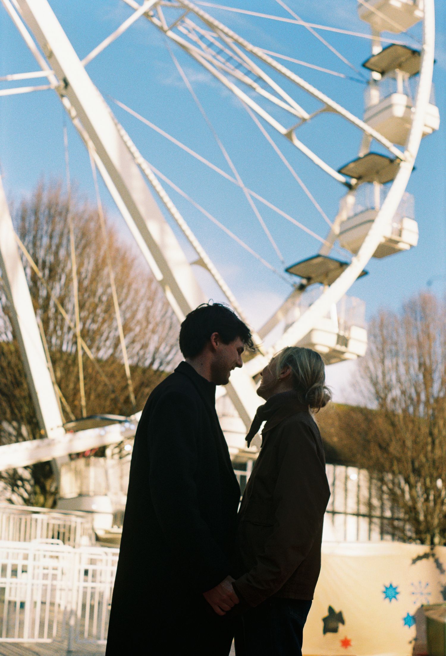 Romantic ferris wheel engagement session at Union Station, St. Louis. Authentic couples photography by Faith’s Flicks.