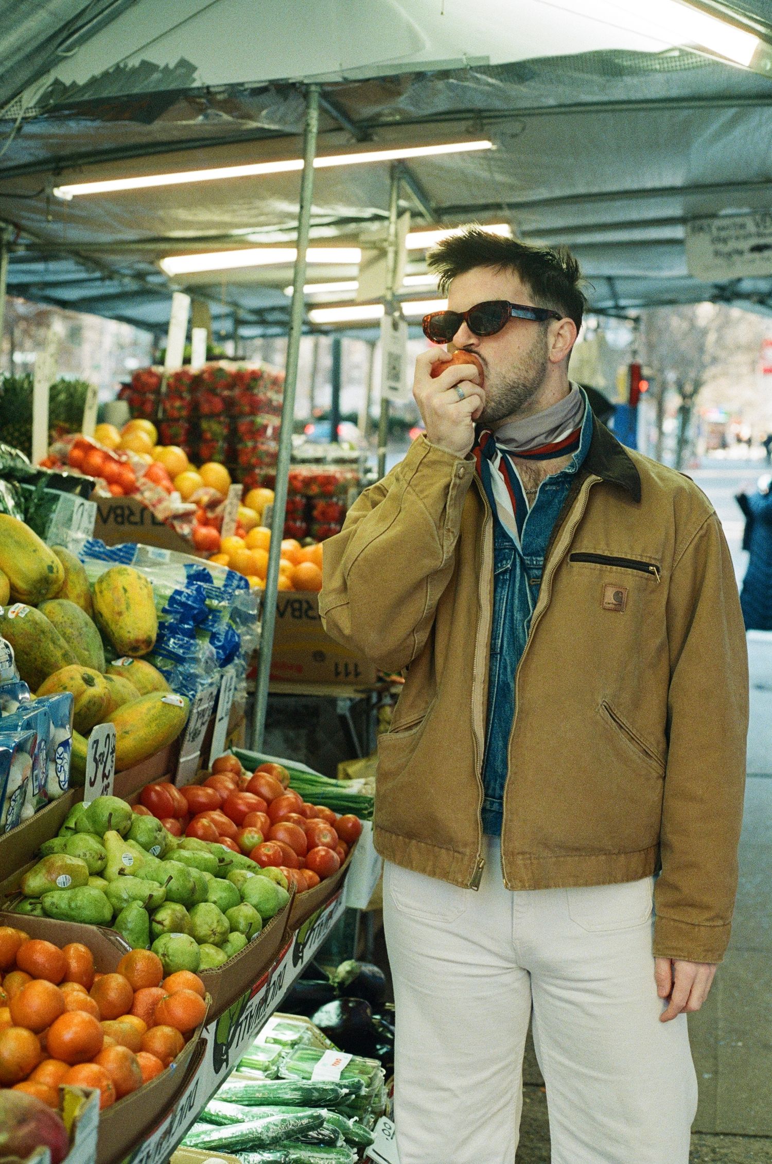 styled portrait shoot at a fruit stand on the uppper west side
