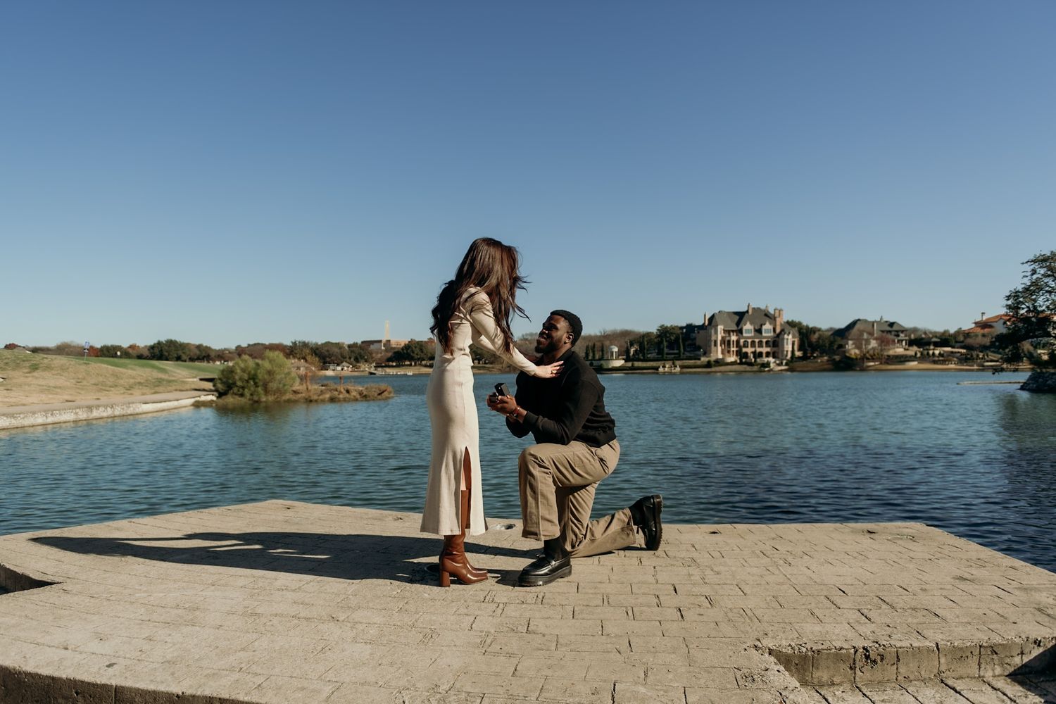 Seaside engagement photoshoot with waterfront views.