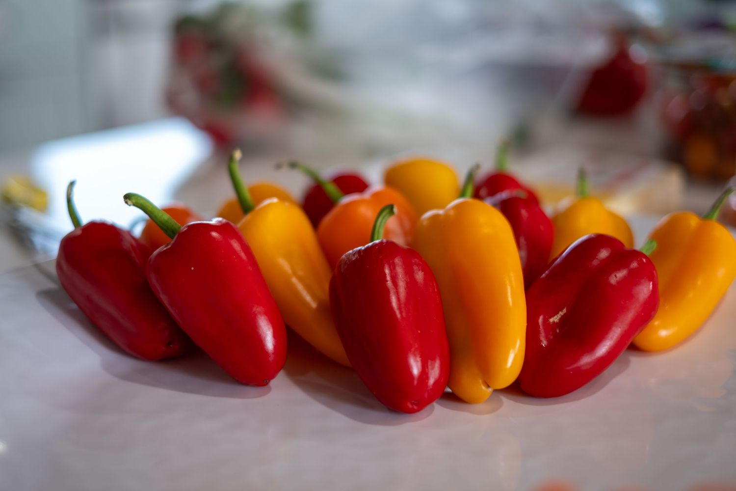 Peppers lined up for a vegetable board.