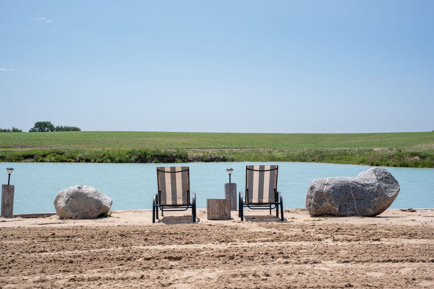 Two chairs overlooking a lake in Nebraska.
