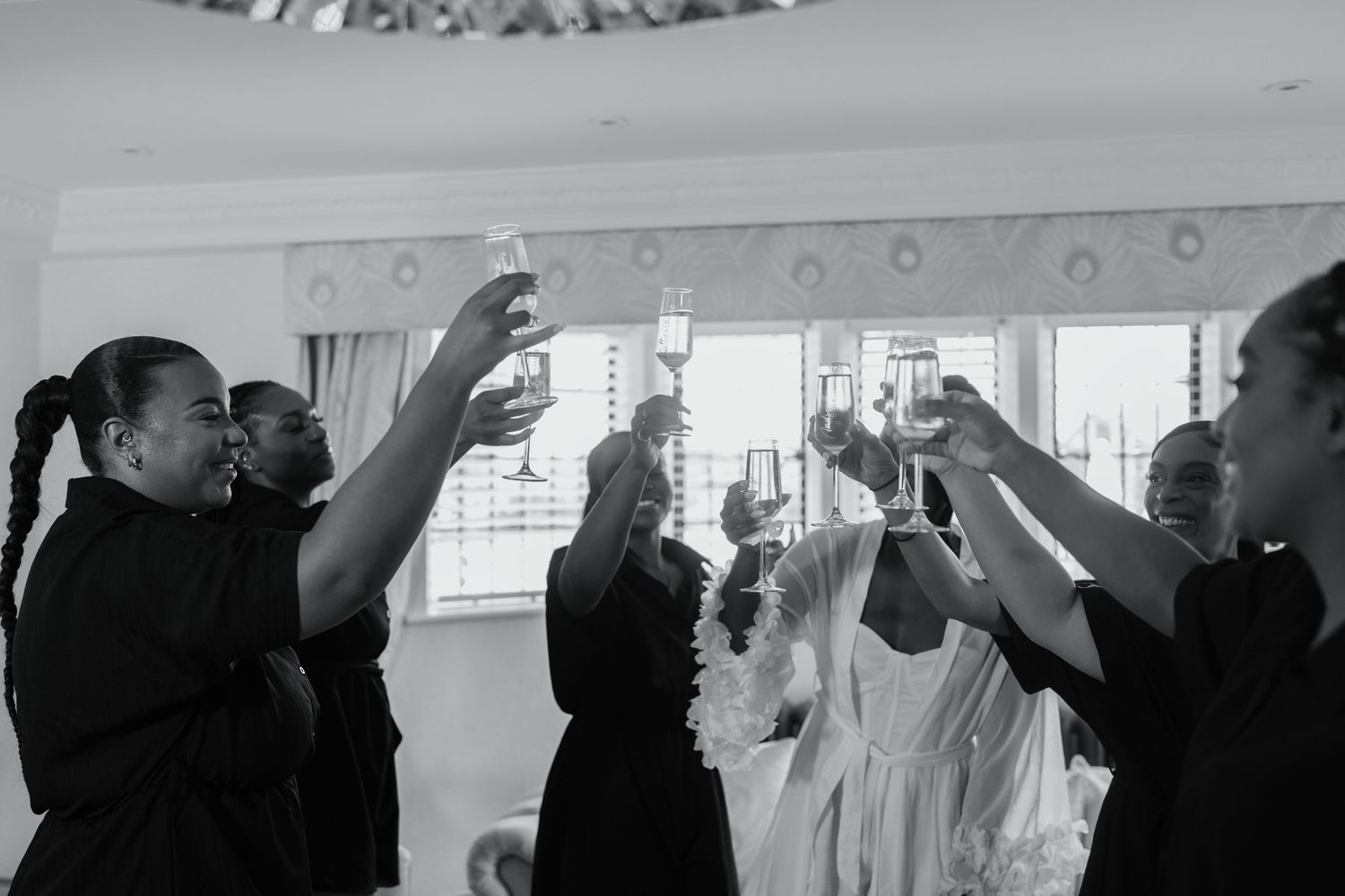 Wedding celebration with people dancing and enjoying themselves in a joyous atmosphere.