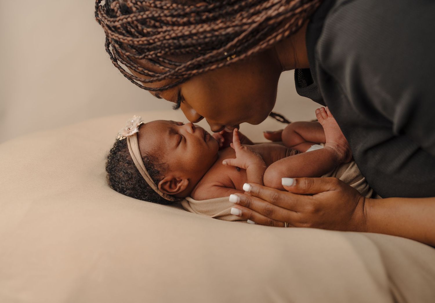 Series of intimate photos showing a baby being held with braided hair visible in frame.