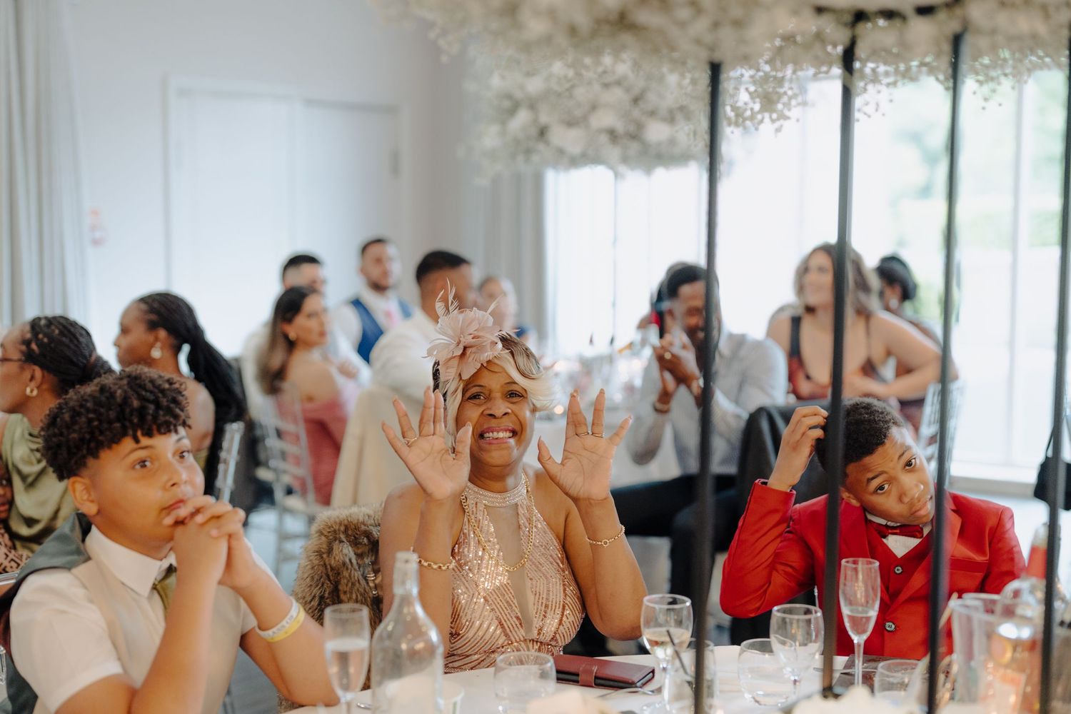 Wedding guests reacting emotionally during reception speeches and toasts.