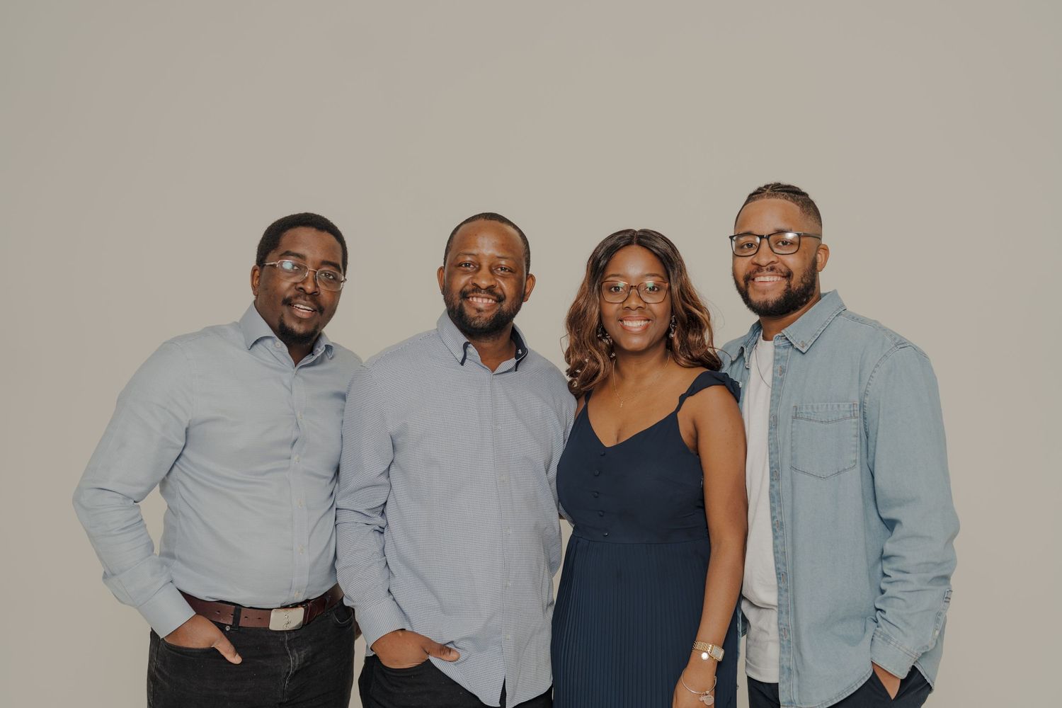 Group photo of family members wearing coordinated light blue and navy outfits.