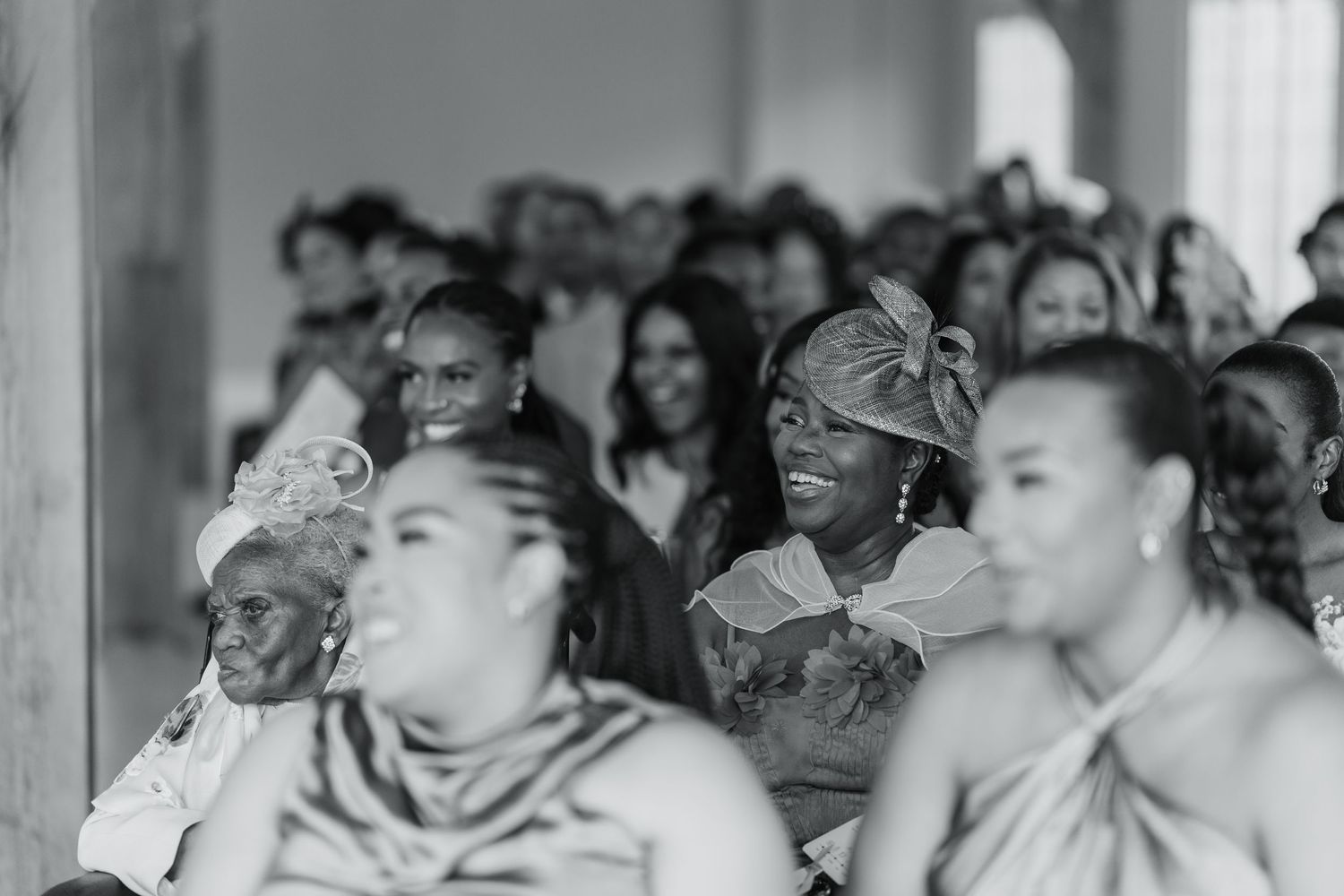 Wedding guests react emotionally during a special moment at the reception.