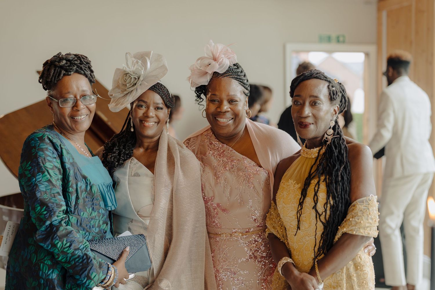 Wedding guests share joyful reactions during an emotional celebration moment.