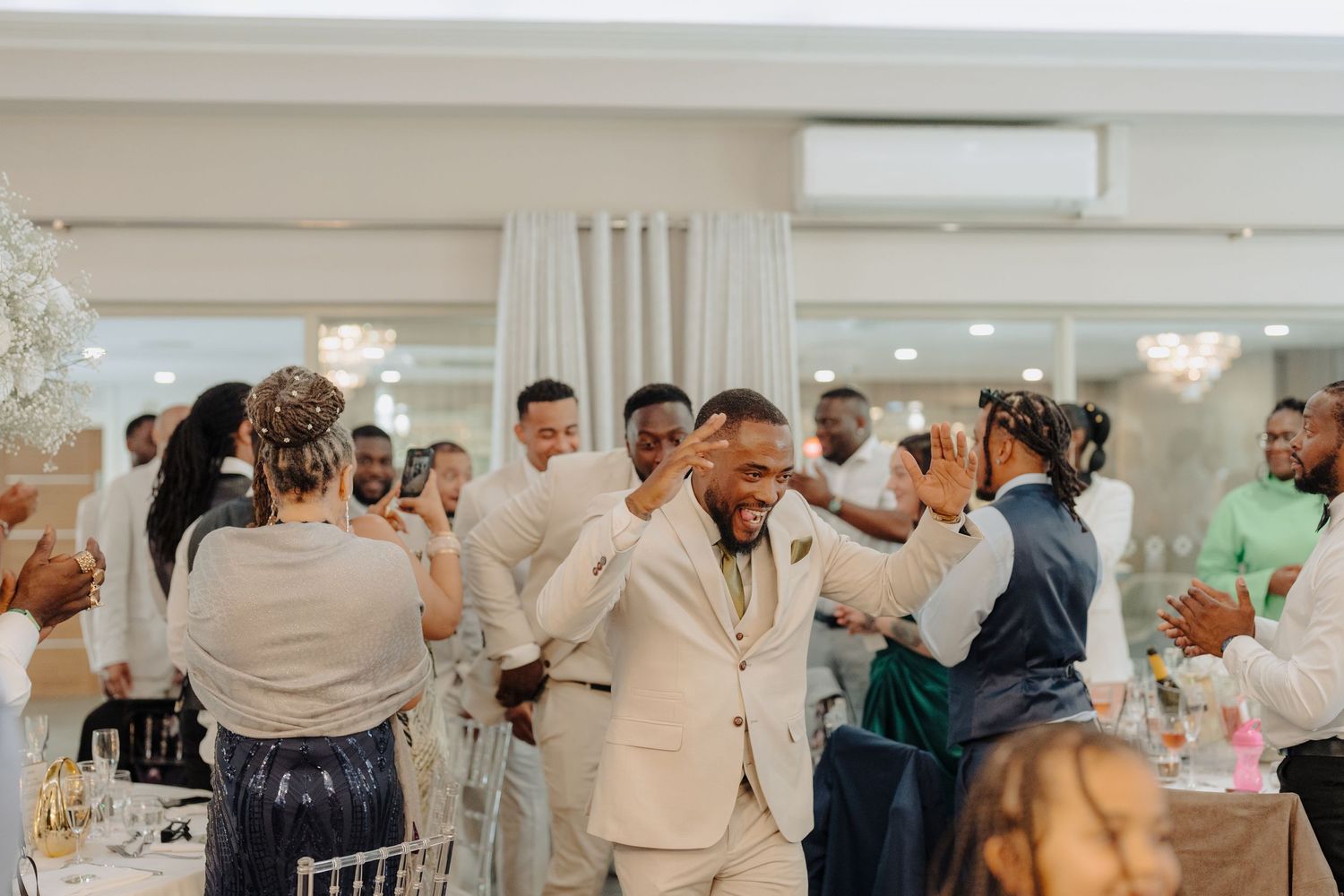 Wedding reception celebration with guests dancing and enjoying the festivities.