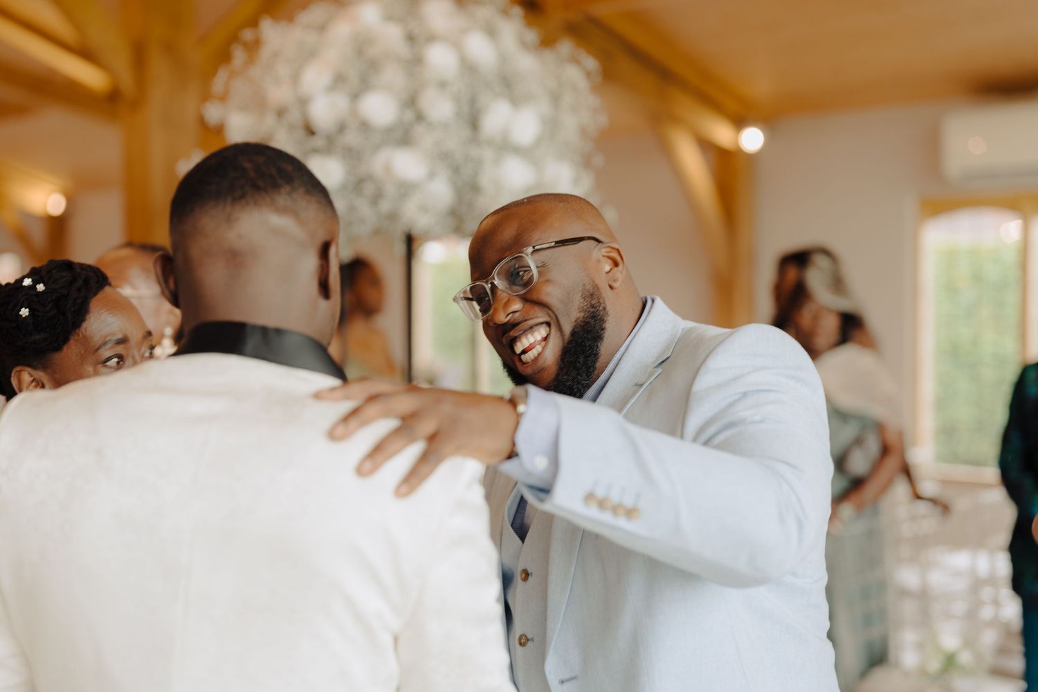 Candid moments of celebration and laughter at an elegant wedding reception.