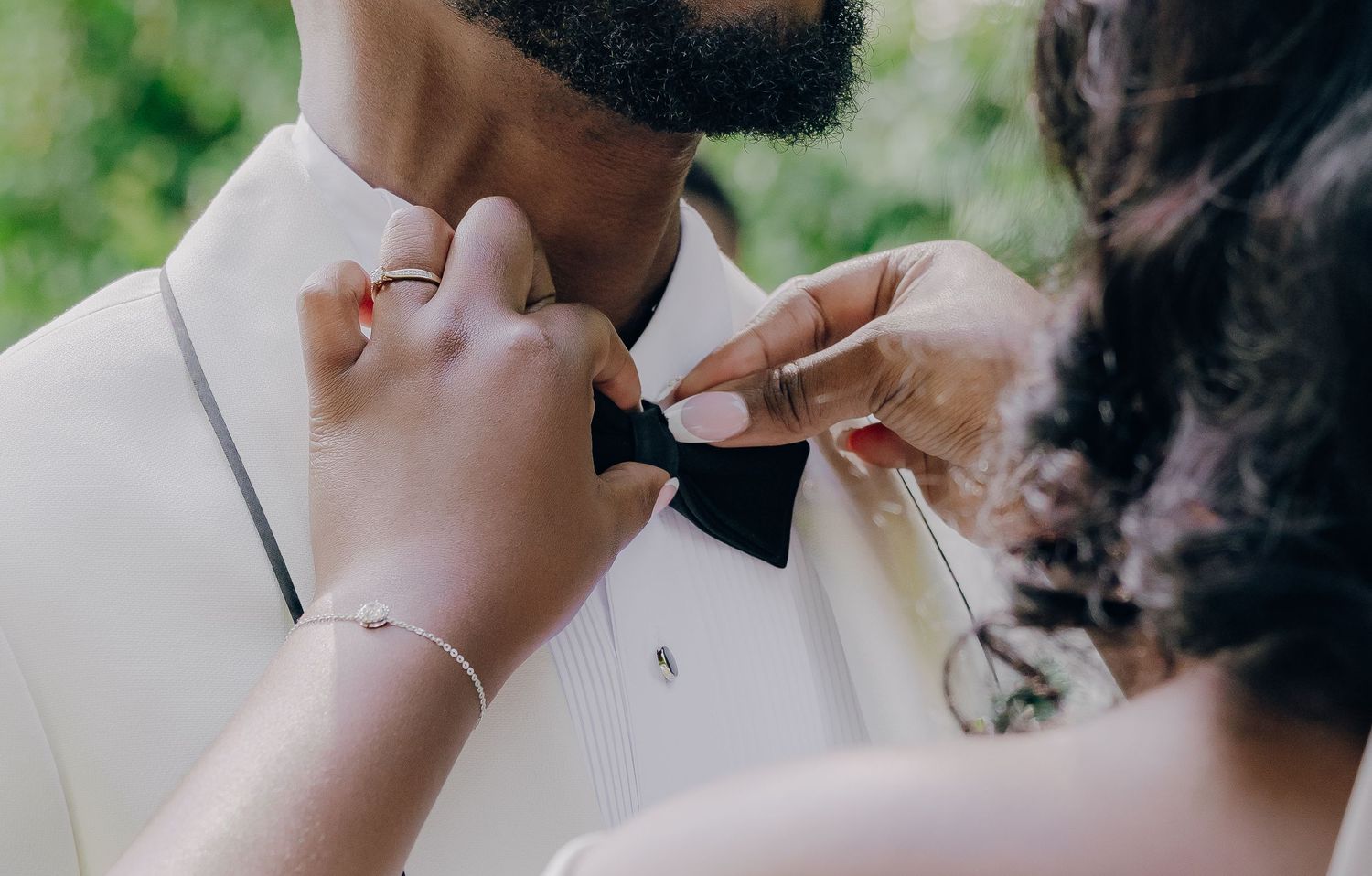 Wedding party members toasting with champagne glasses in a candid celebration moment.