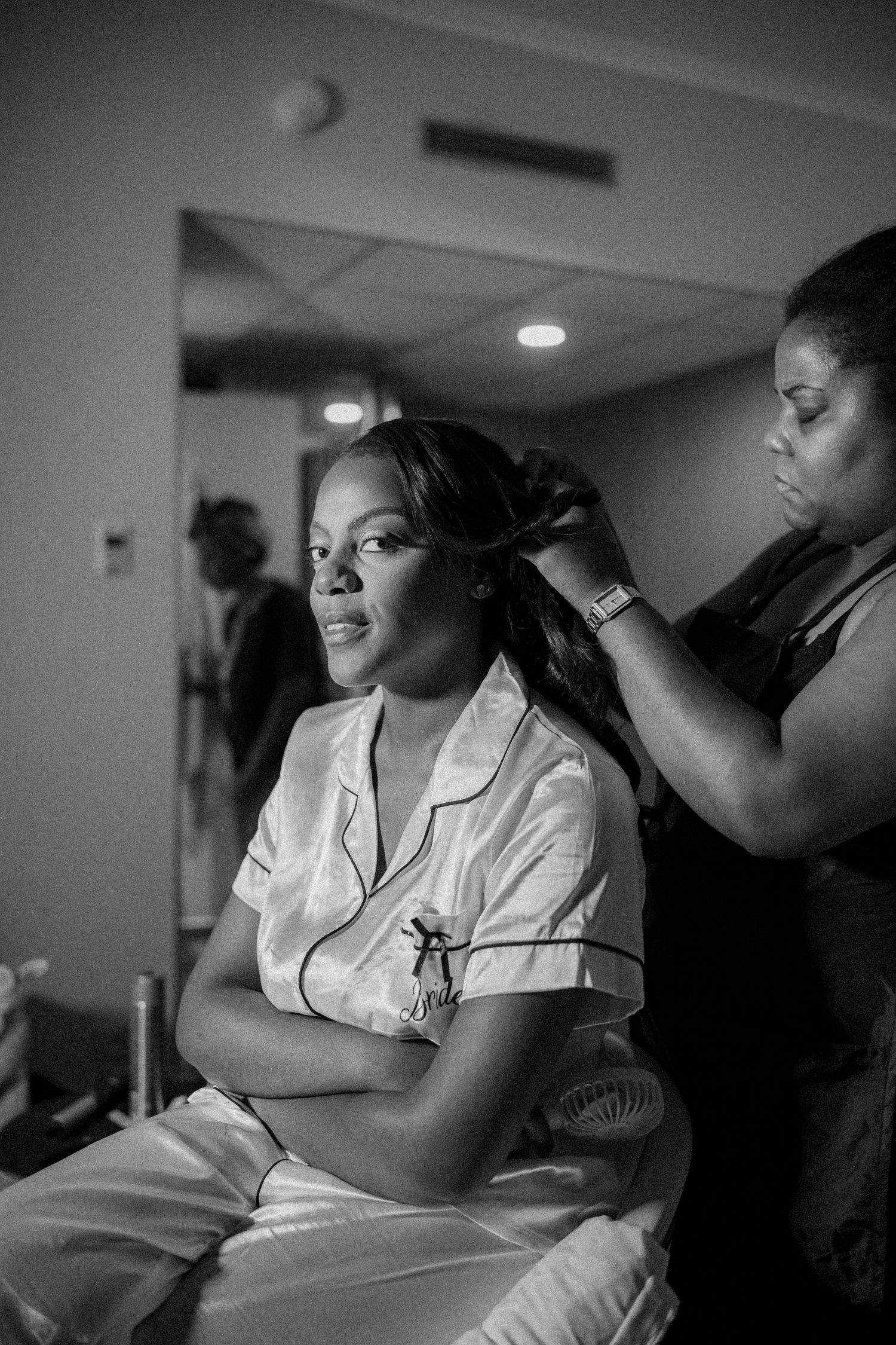 A series of black and white photos showing emotional moments during labor and childbirth in a medical setting.