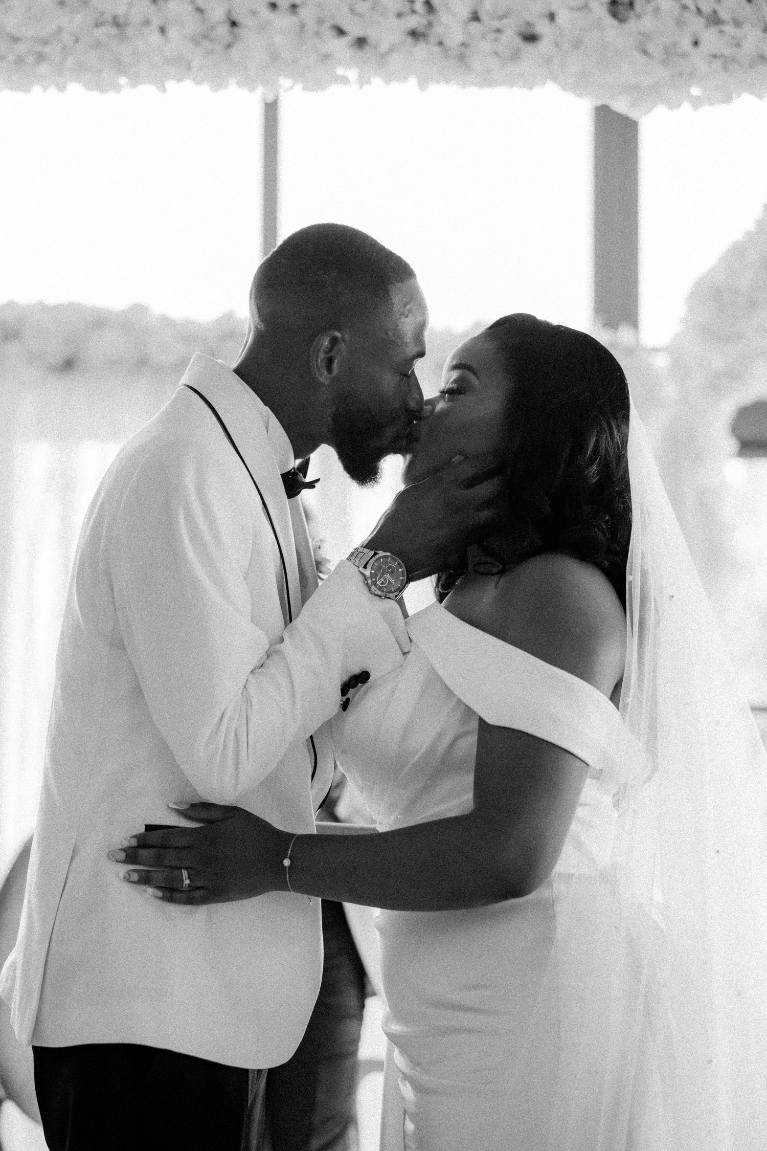 Series of romantic black and white wedding photos showing tender moments.