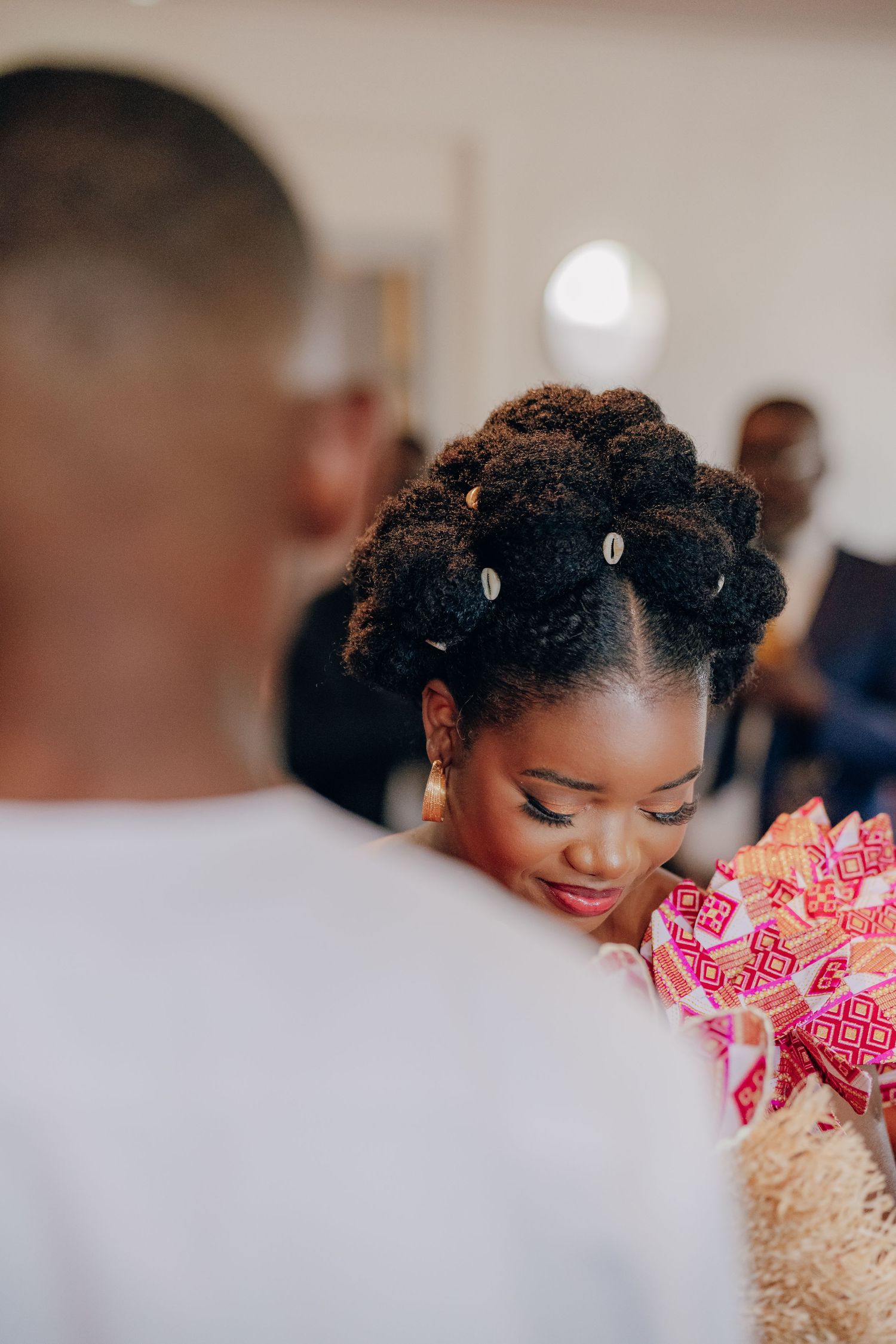 A couple shares an intimate moment during their wedding photoshoot with soft lighting and romantic ambiance.