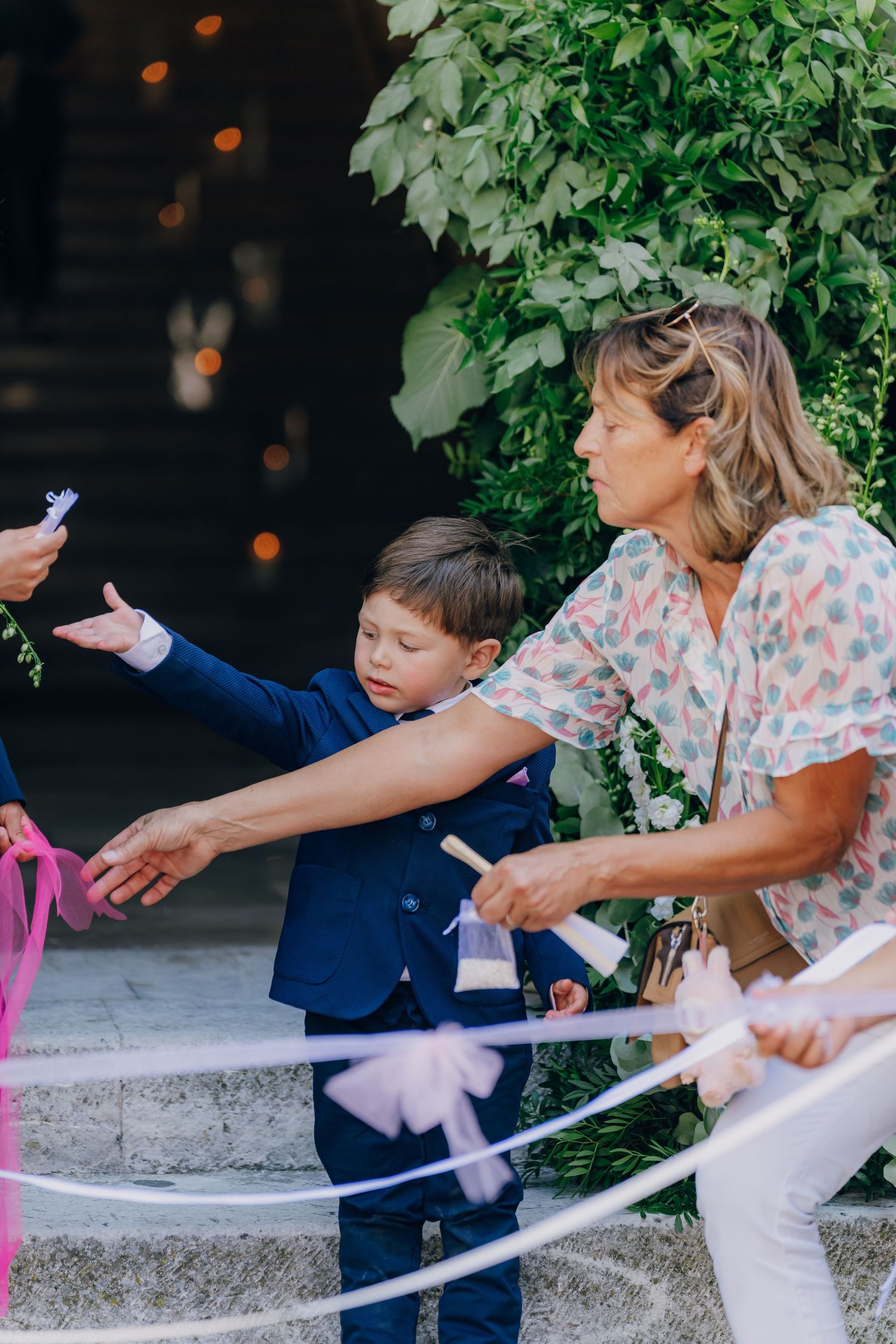 A sequence of photos showing a child and adult releasing a dove together outdoors on a sunny day.