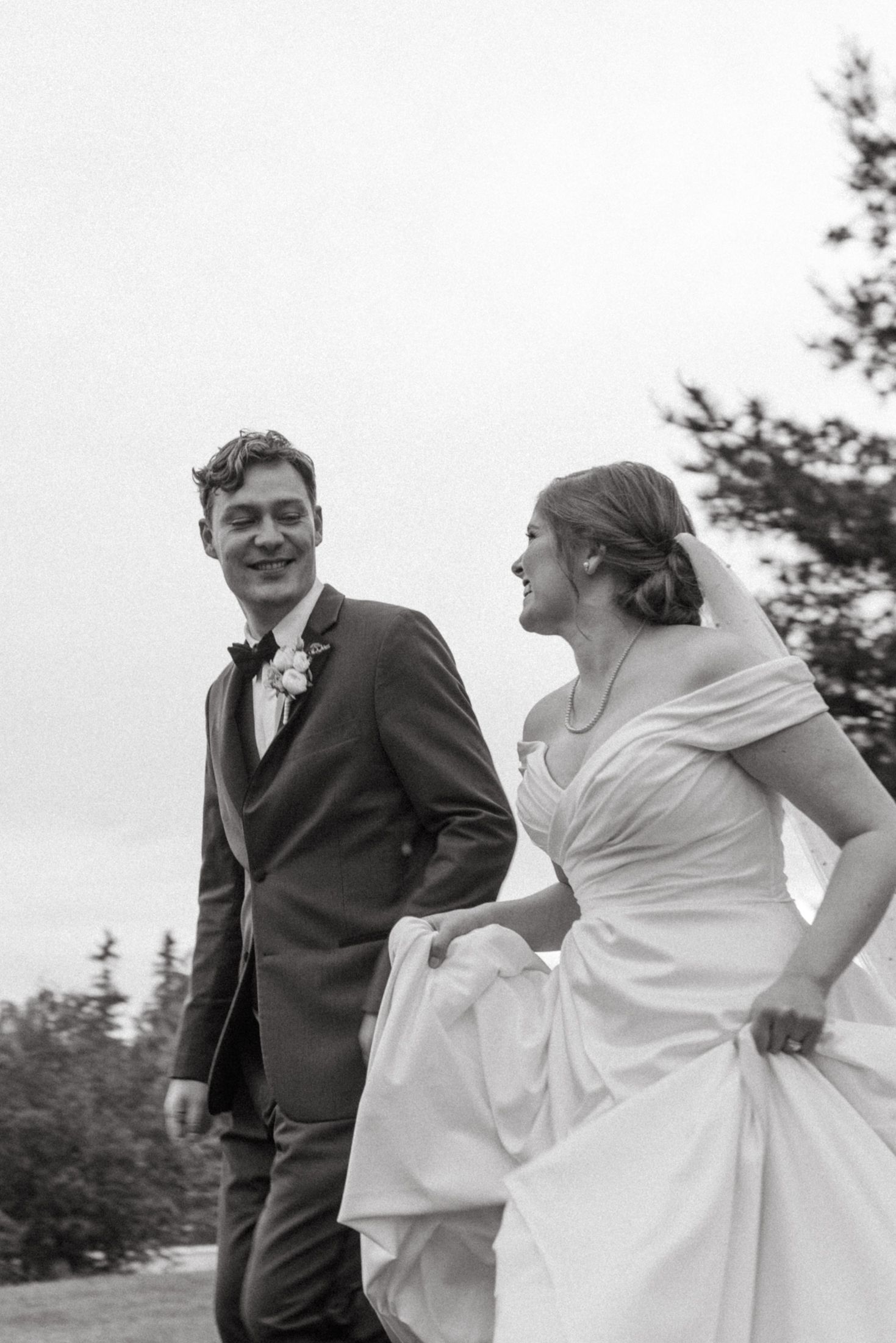 Wedding photographer taking candid photo outdoors in North Bay Ontario