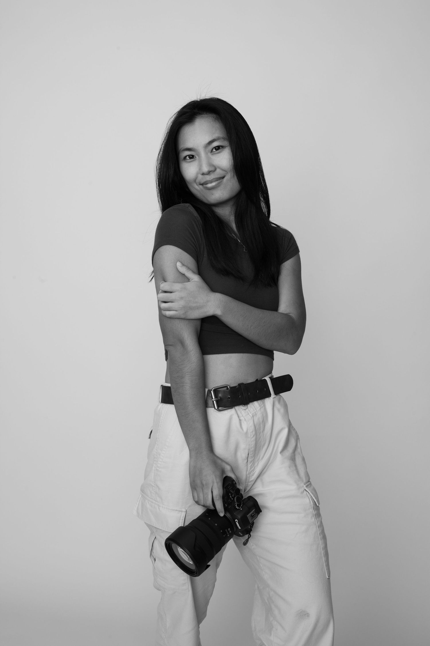 Rina, hawaii wedding and couples photographer, posing with a bright friendly smile.