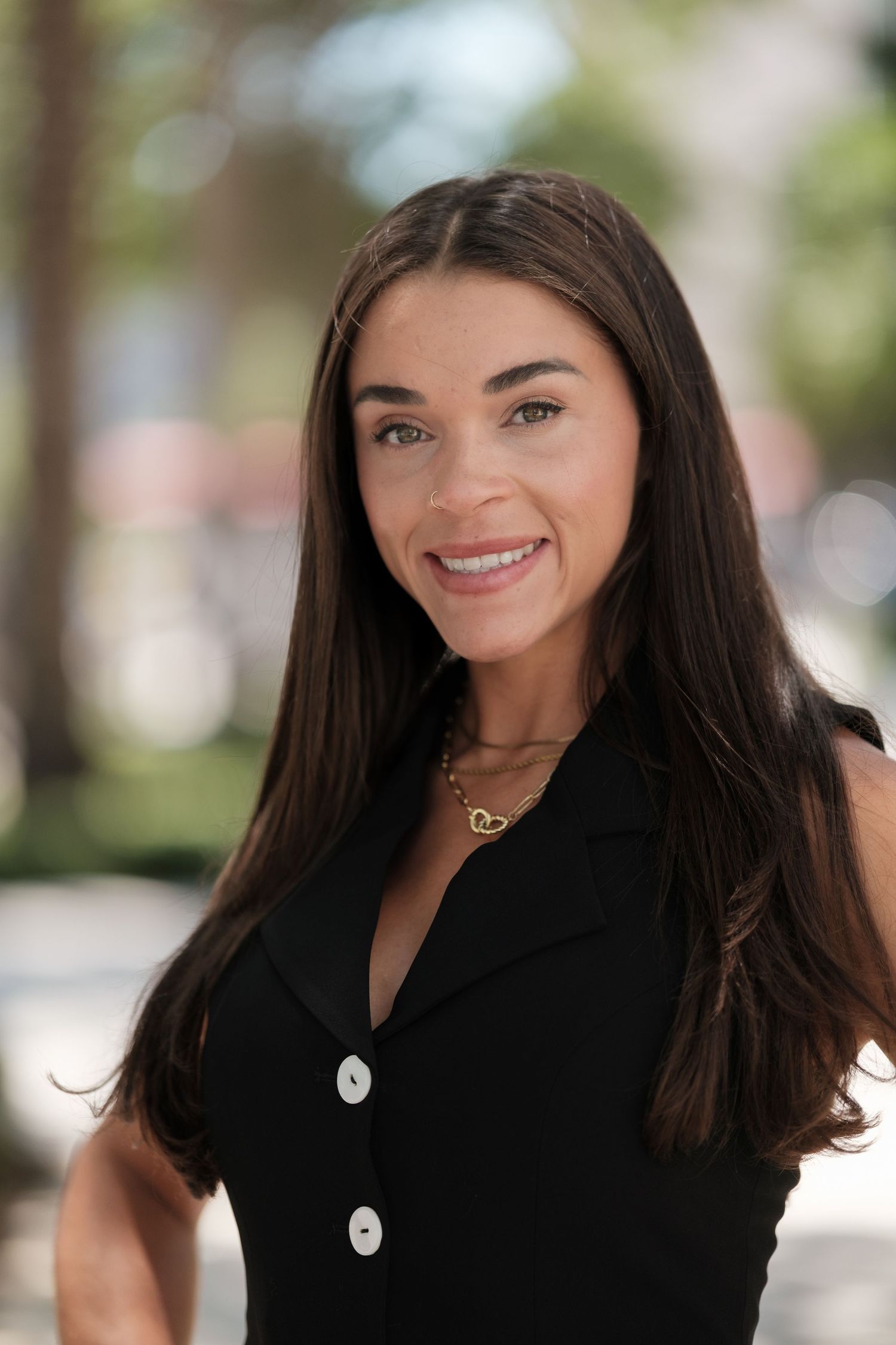 Professional headshots showing a woman with dark hair and a bright smile in a black top against a blurred background.