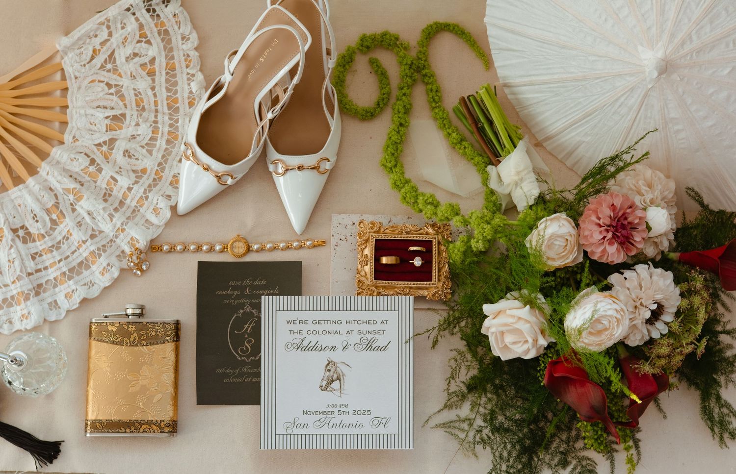 Elegant wedding decor details with lace, parasols, and floral arrangements.