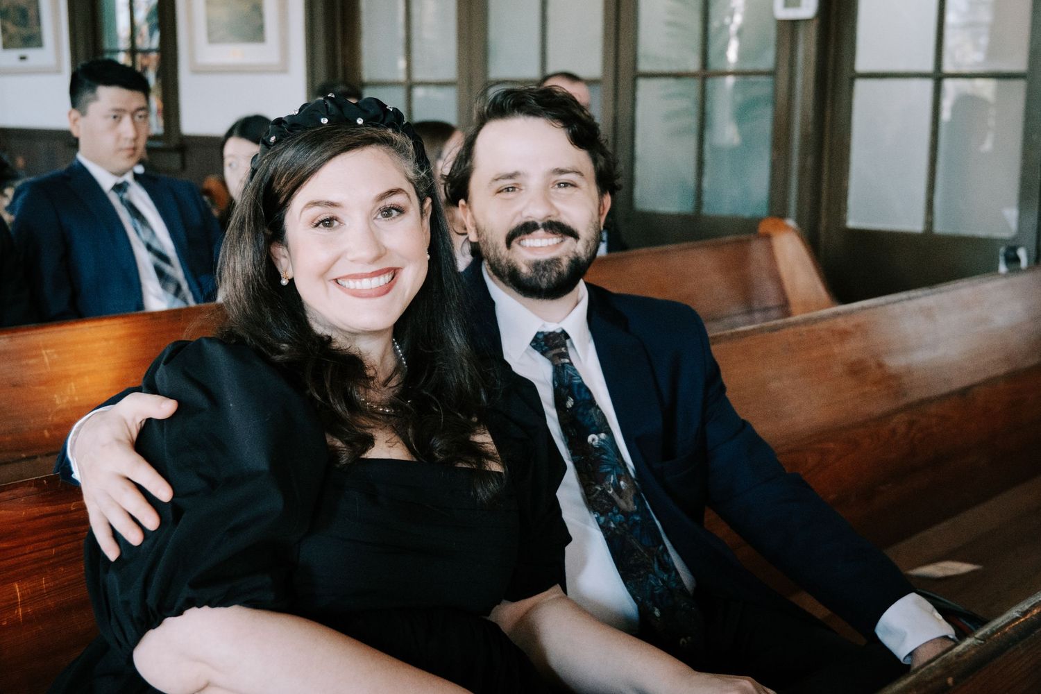 A series of candid moments captured in black and white showing couples sitting together in church pews.