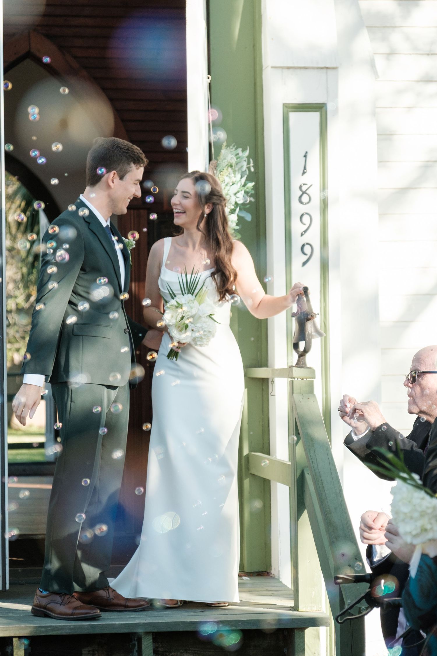 A series of candid wedding moments showing a couple laughing and celebrating by a green doorway.