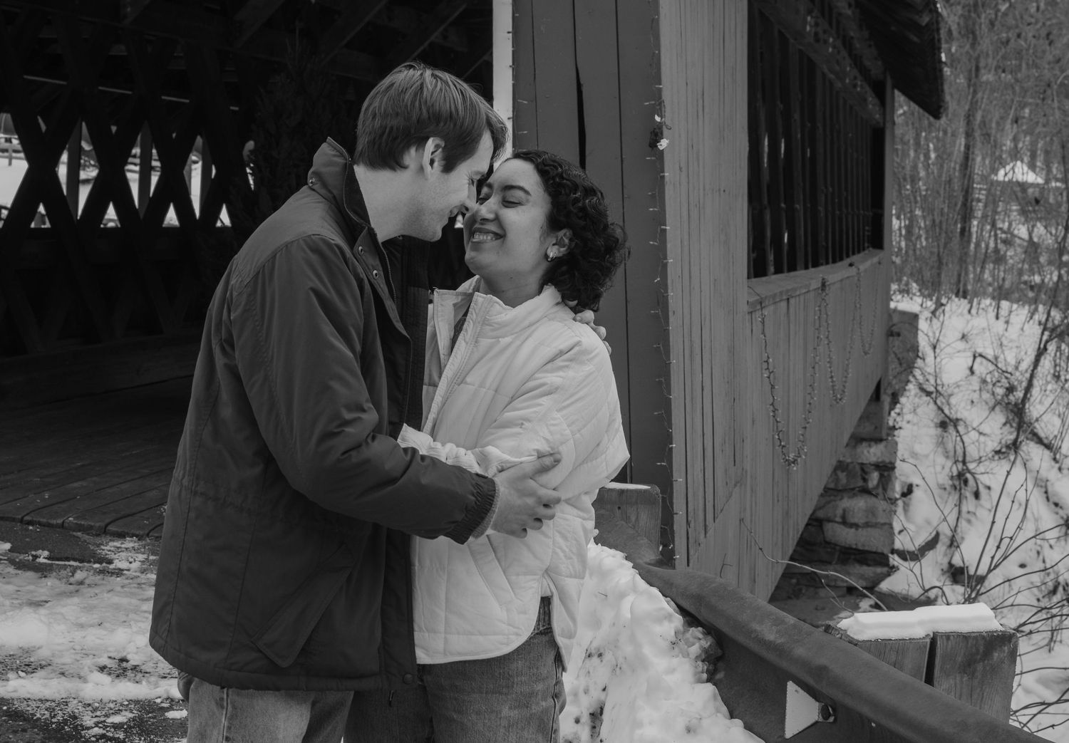 A black and white photo collage showing romantic moments between a couple at their wedding celebration.